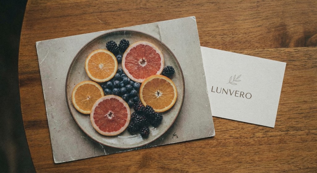 Sliced citrus fruits and berries arranged on a table